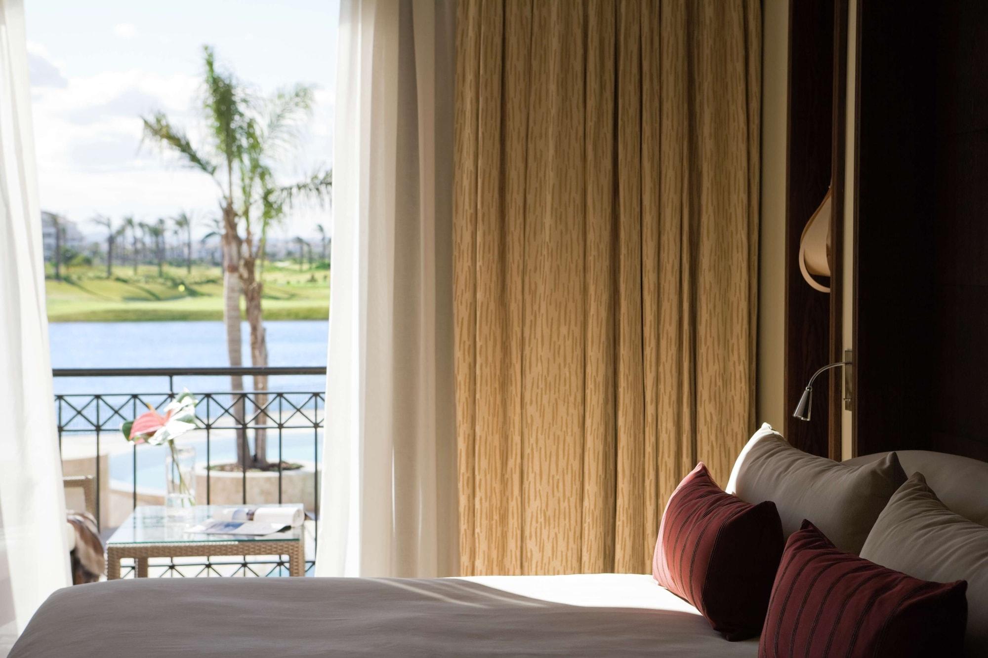Doubletree By Hilton La Torre Golf Resort Roldan Ngoại thất bức ảnh A bedroom at the resort